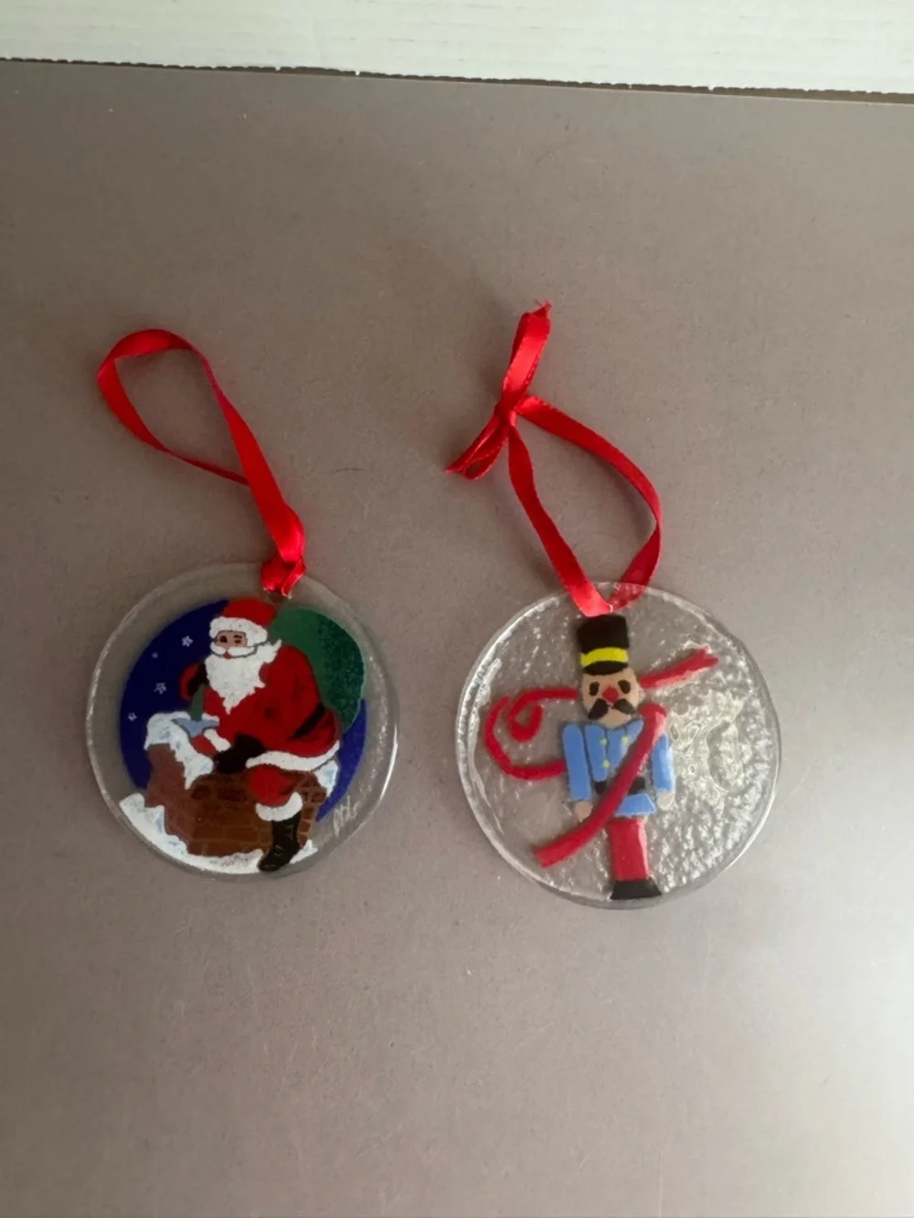 Peggy Karr Santa and Nutcracker Glass Ornament Pair